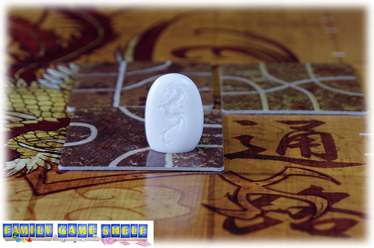 Tsuros makers follow the lines of any tiles that touch thier lines.