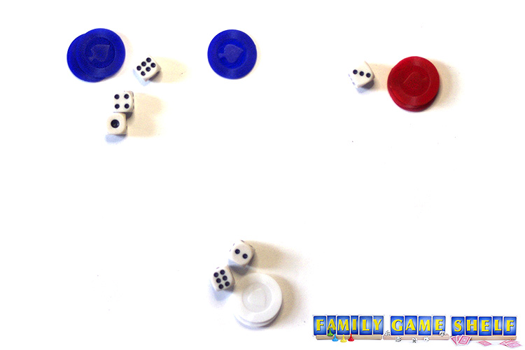 Poker chips and dice showing a game of Volcano for this Luau Game