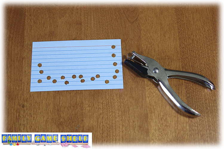 Index card with holes punched in it