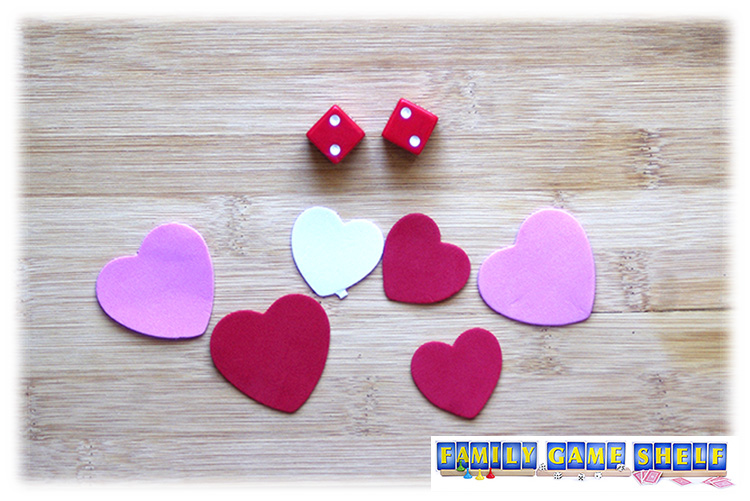 Valentine's Day Dice Gamer Pass the Love player with 6 hearts and a roll of two 2s