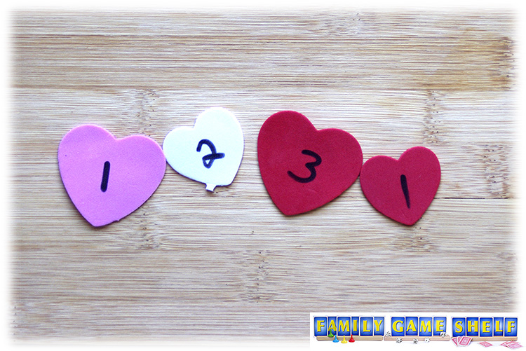 Valentine's Day Dice Game Pass the Love player with heart points adding up to 7