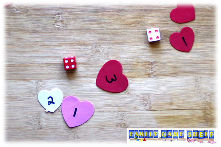Valentine's Day Dice Game player with a matching roll of 4