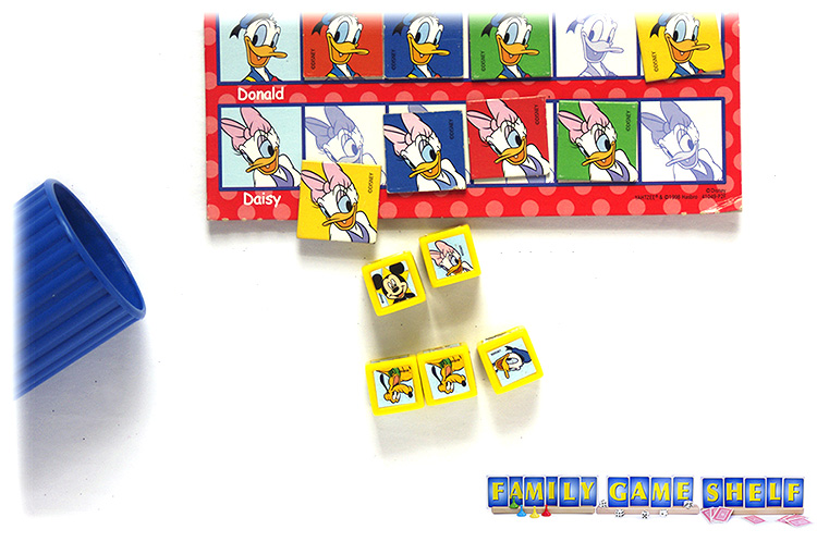 A Yahtzee Jr roll of 1 Mickey 1 Daisey but the 2 spot is taken so must score 1