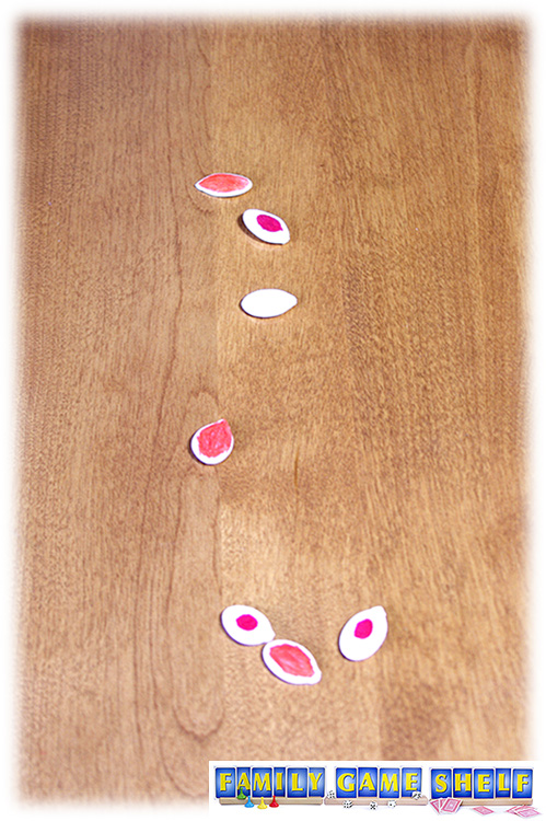 Pumpkin Seed Games Baci Seed with coloured seeds close to a white seed