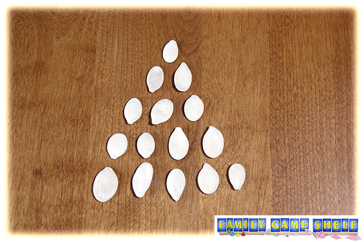 A pile of 15 pumpkin seeds