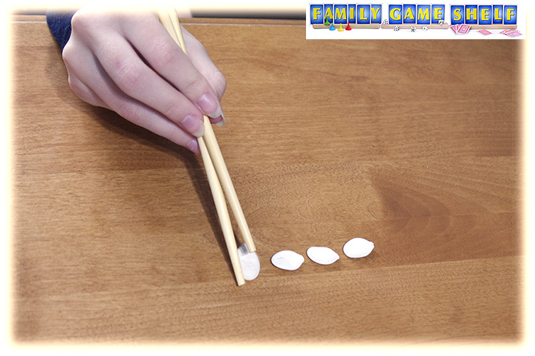 Chop sticks putting sees in a line