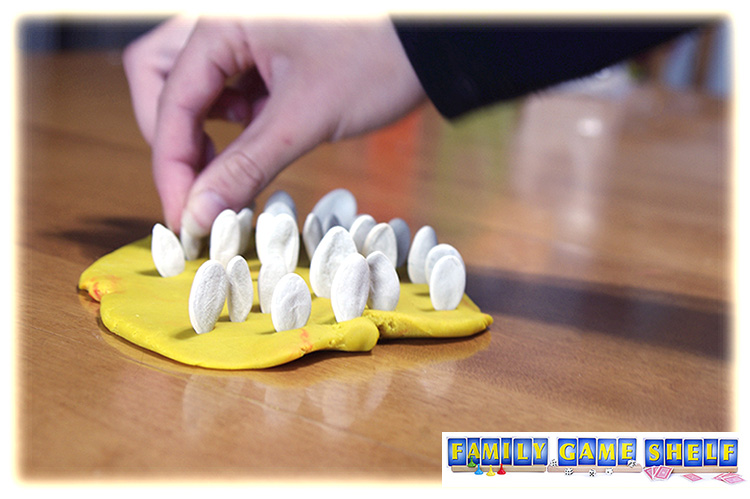 Pumpkin seeds stuck in playdough for Pumpkin Seed Minute to Wit Game