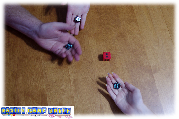 Red dice showing number two with three Grim Reaper dice game players rolling