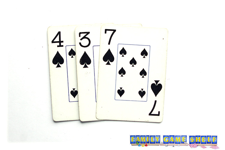 Christmas Crazy 8s stack cards of 4, 3 and 7 of spades