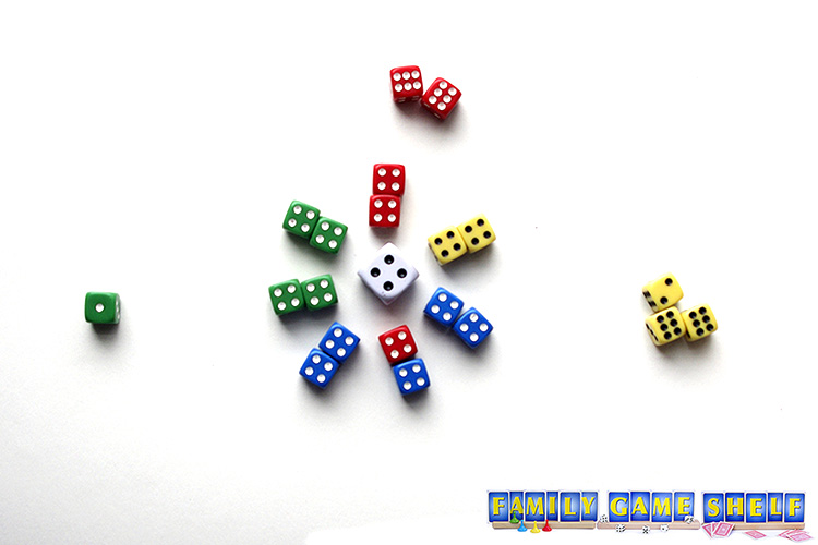The blue Snowball player has won the round by getting all her dice into the middle.