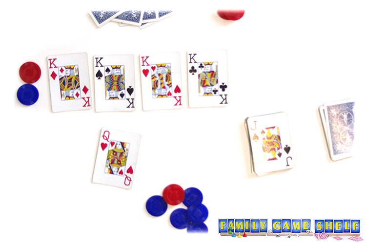 King's Market player putting her last card down and collecting the middle chips.