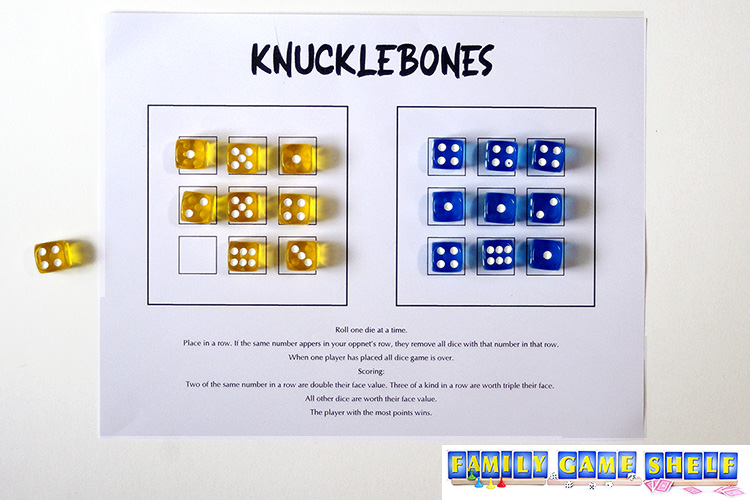 Knucklebones game at the scoring stage.