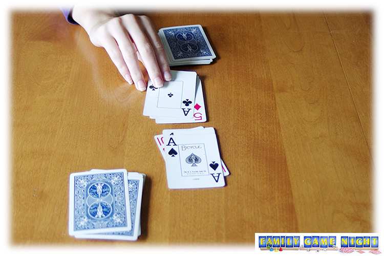 A Snap card game player flipping over an ace that matches the card already showing.