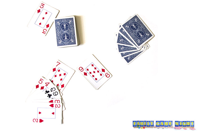 Go TO Pack card game players with a diamond card flipped form the deck