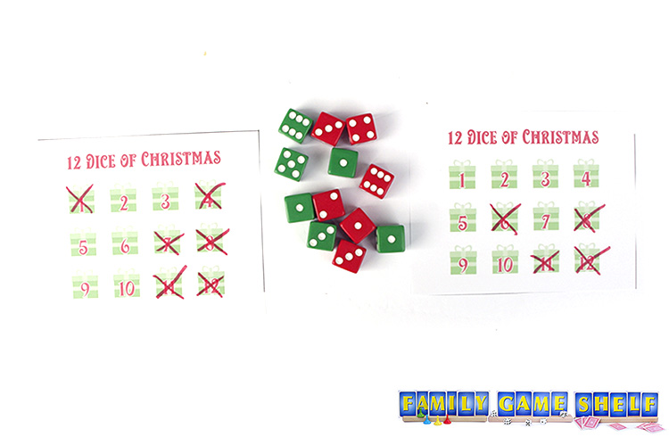 12 Dice of Christams players with score cards both having high numbers crossed off.
