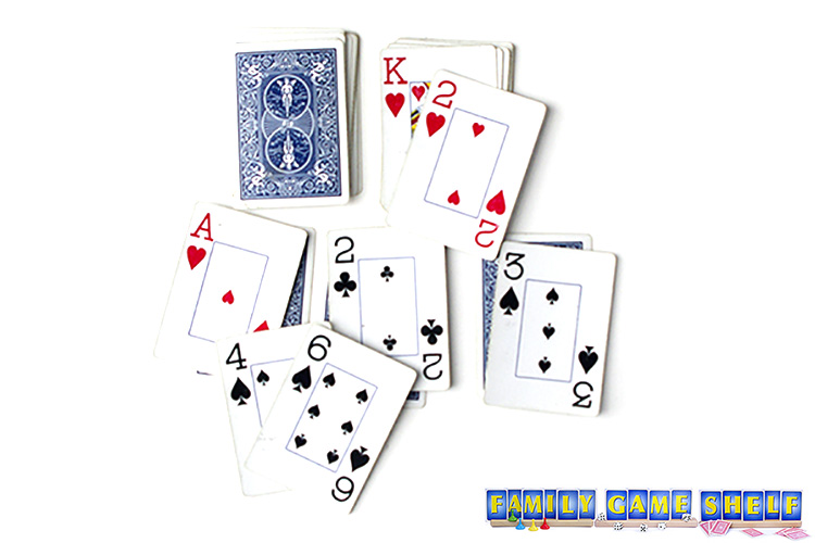 A player placing a 2 on the pile