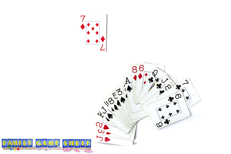 The start of a game of Sevens with the seven of diamonds on the table and a player's hand with options.