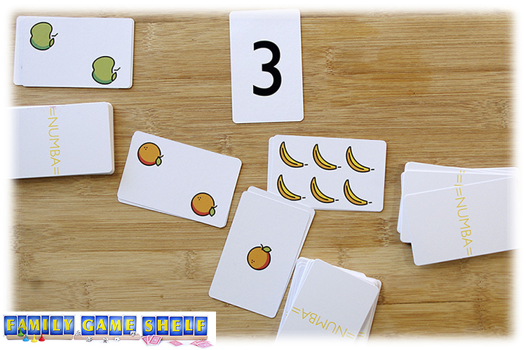 Numba cards that show 1 and 2 oranges to add up to three
