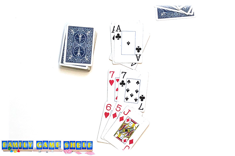 Dump the Black card game player with a black 7 and a red 7