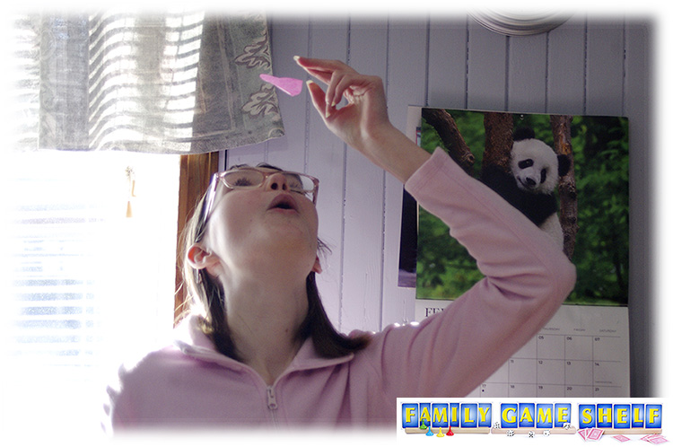 Don't be last Valentine's Day game player blowing a tissue paper heart up in the air