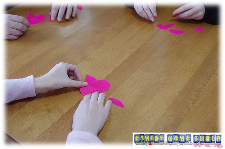 Don't Be Last Valentine's Day game players with heart puzzles 