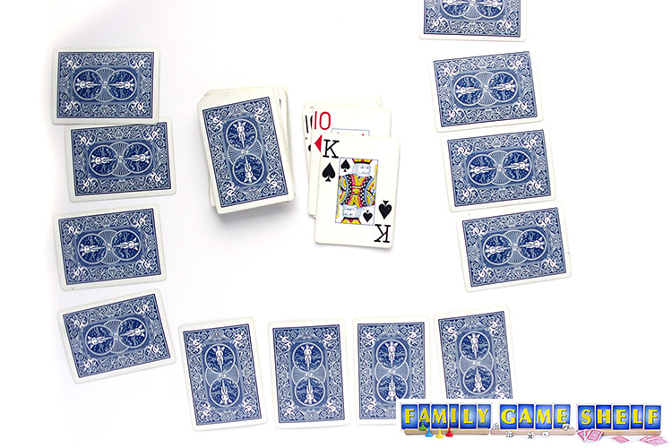 Rat-A-Tat Tat card game player with a king