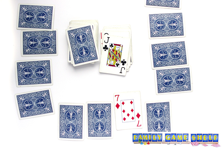 Rat-A-Tat Tat card game player with a jack and a peak at a card
