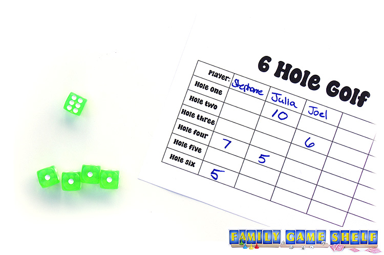 A 6 Hole Golf player with one last roll for hole one.