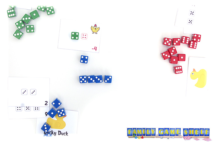 A Chicken Pox dice game player rolling a dice to gain a negative card